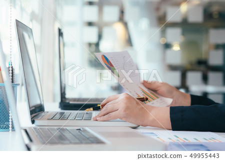 Entrepreneur using mobile laptop for analyse a 49955443
