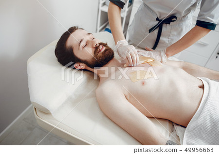 Handsome man in a beauty salon Handsome man in a beauty salon 49956663