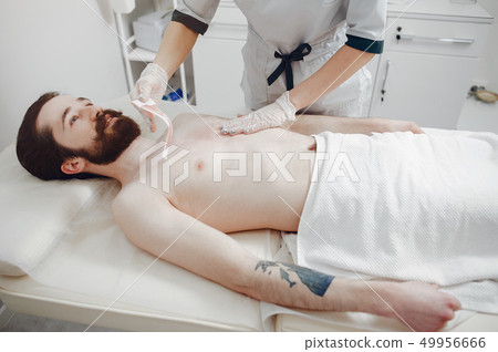 Handsome man in a beauty salon Handsome man in a beauty salon 49956666