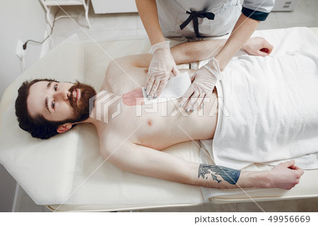 Handsome man in a beauty salon Handsome man in a beauty salon 49956669