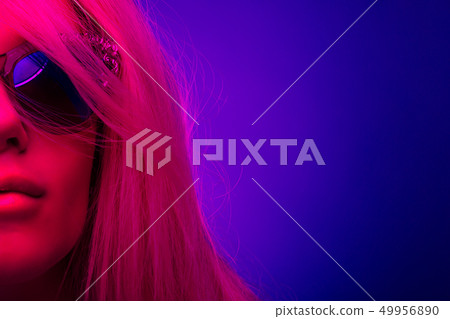 Neon light studio close-up portrait. Studio shot 49956890