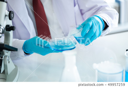 Scientists working at the laboratory. Scientists working at the laboratory. 49957259