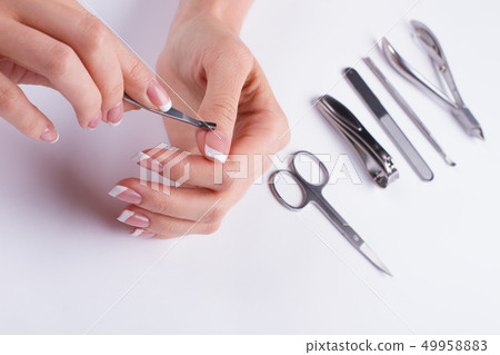 Removing cuticle. Manicure set. Removing cuticle. Manicure set. 49958883