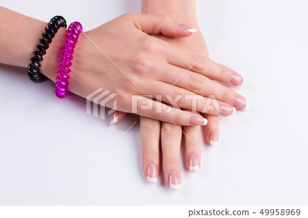Gentle french manicure on white background. 49958969