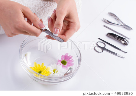 Woman hands hold manicure nail file. 49958980