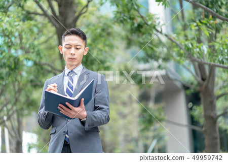 Businessman outdoors Businessman outdoors 49959742