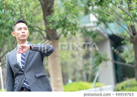 Businessman outdoors 49959763