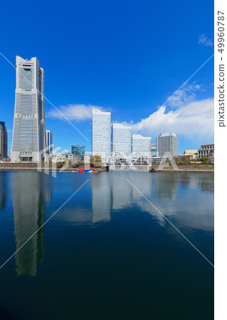Yokohama Minato Mirai and cherry blossoms in full bloom Yokohama Minato Mirai and cherry blossoms in full bloom 49960787