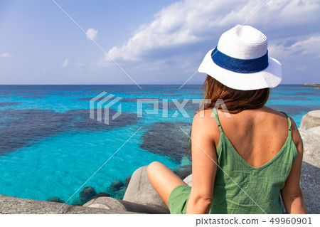 Girl looking at the sea Girl looking at the sea 49960901