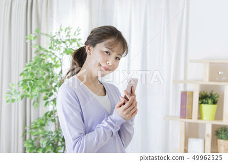 Young woman with smartphone 49962525