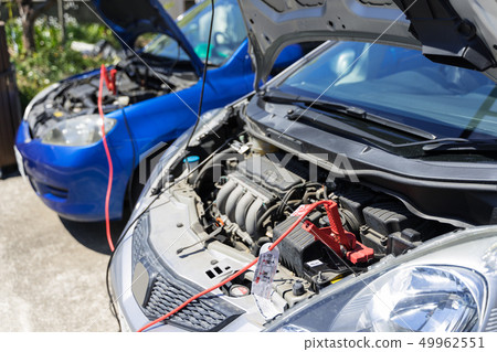 Car battery run-up and first aid Jumping start with booster cable Car battery run-up and first aid Jumping start with booster cable 49962551