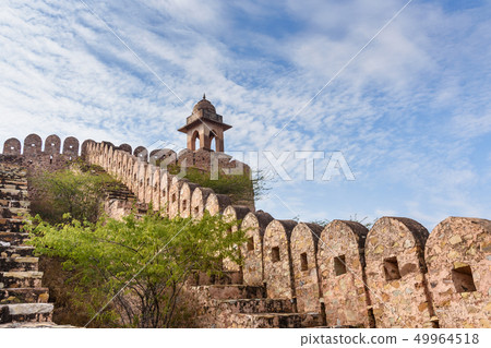 Ancient long wall with towers around Amber Fort. Ancient long wall with towers around Amber Fort. 49964518