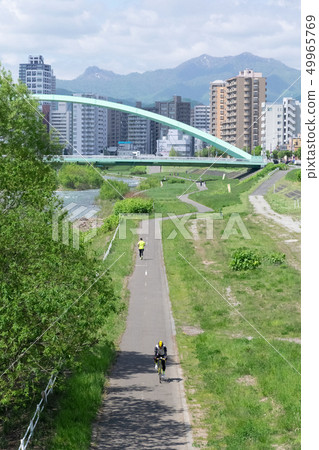 People running and cycling in Sapporo Toyohira River People running and cycling in Sapporo Toyohira River 49965769