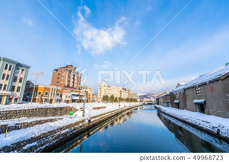 Beautiful landscape and cityscape of Otaru canal river in winter and snow season 49968723