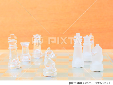 chess glass on board in game. On a vintage wooden 49970674