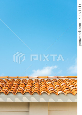 Blue sky and Okinawa red tiled roof 49971413