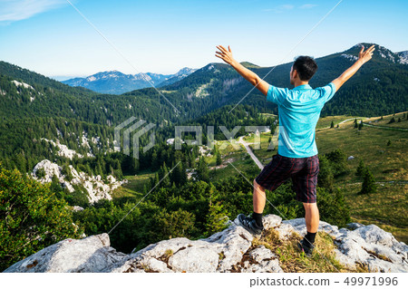 Man traveler hiking across Croatia landscape. Man traveler hiking across Croatia landscape. 49971996