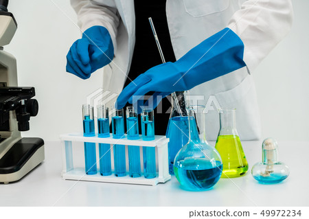 Woman scientist working in chemist laboratory. Woman scientist working in chemist laboratory. 49972234