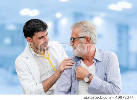 Doctor checking patient health in hospital office. 49972374