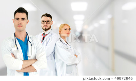 Doctor working in hospital with other doctors. Doctor working in hospital with other doctors. 49972946