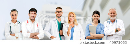 Doctor working in hospital with other doctors. Doctor working in hospital with other doctors. 49973063