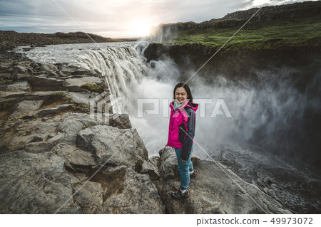 Traveler Travels to Dettifoss Waterfall in Iceland Traveler Travels to Dettifoss Waterfall in Iceland 49973072