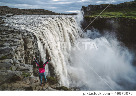 Traveler Travels to Dettifoss Waterfall in Iceland Traveler Travels to Dettifoss Waterfall in Iceland 49973073