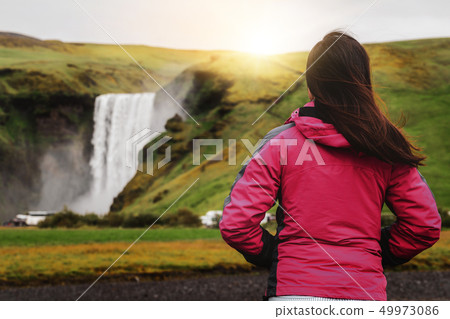 Traveler travel to Skogafoss Waterfall in Iceland. 49973086