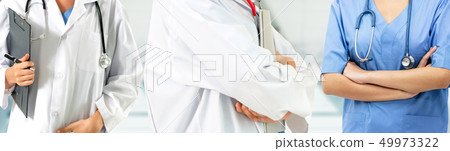 Doctor working in hospital with other doctors. Doctor working in hospital with other doctors. 49973322