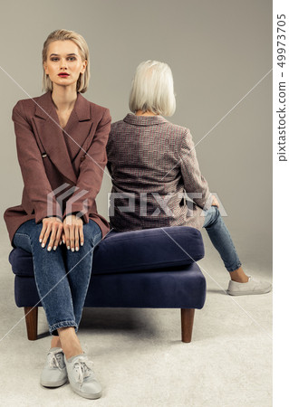 Beautiful attractive woman wearing a stylish jacket Beautiful attractive woman wearing a stylish jacket 49973705