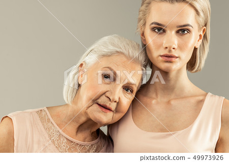 Portrait of nice pleasant mother and daughter 49973926