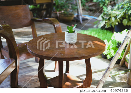 wood chair table on terrace balcony with garden view wood chair table on terrace balcony with garden view 49974286