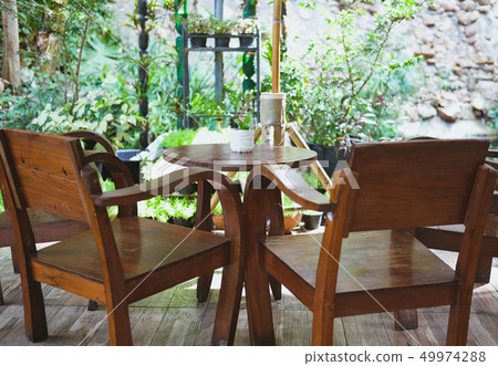 wood chair table on terrace balcony with garden view 49974288