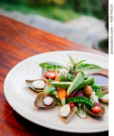 Avocado artichke and mix vegetables salad Avocado artichke and mix vegetables salad 49974929