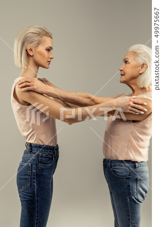 Nice pleasant women looking at each other Nice pleasant women looking at each other 49975667