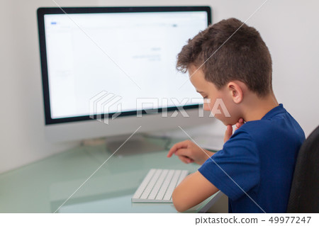 New media education, kid watching learning lessons on pc. Virtual classroom New media education, kid watching learning lessons on pc. Virtual classroom 49977247