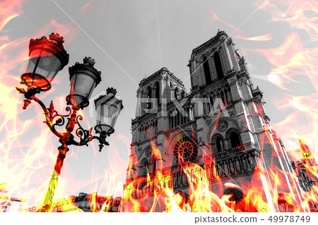 Notre Dame Cathedral burning by massive fire, representation. Notre-Dame de Paris in fire. Photo Notre Dame Cathedral burning by massive fire, representation. Notre-Dame de Paris in fire. Photo 49978749