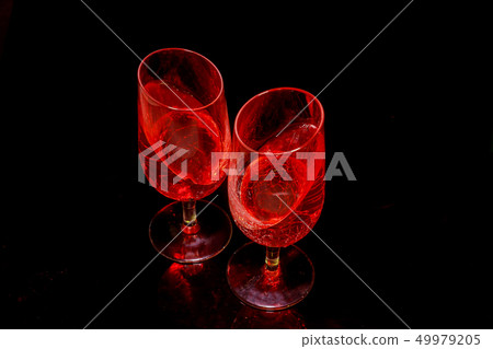 Two glasses with a pink drink juice jelly 49979205