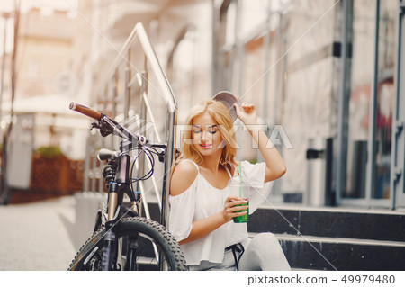 stylish girl with bicycle 49979480