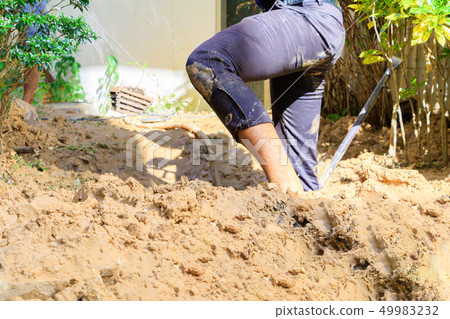 male plumber are repair broken pipe in hole male plumber are repair broken pipe in hole 49983232