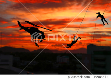 Silhouette Soldiers rappel down to attack Silhouette Soldiers rappel down to attack 49983312