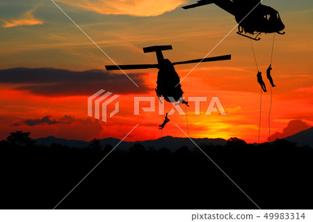 Silhouette Soldiers rappel down to attack Silhouette Soldiers rappel down to attack 49983314