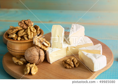 Cheese camembert or brie with walnut kernels 49985080