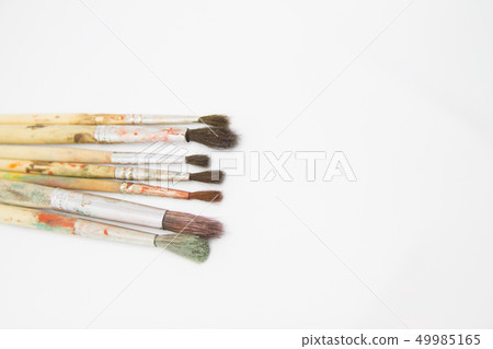 Paint brushes and paints for drawing isolated on white background Paint brushes and paints for drawing isolated on white background 49985165