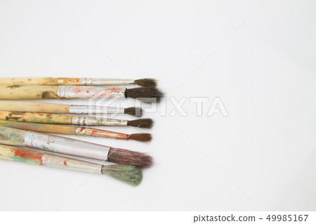 Paint brushes and paints for drawing isolated on white background Paint brushes and paints for drawing isolated on white background 49985167