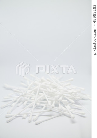 Vertical banner with cotton buds heap isolated on the white copy space background Vertical banner with cotton buds heap isolated on the white copy space background 49985182