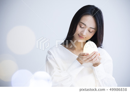 A woman with eggs A woman with eggs 49986838