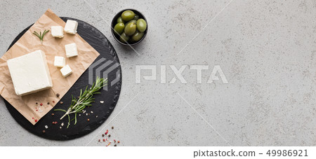 Block of butter and spices on concrete background 49986921