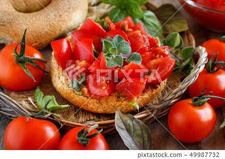 Frisella seasoned with tomatoes and herbs Frisella seasoned with tomatoes and herbs 49987732