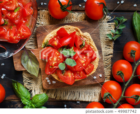 Frisella seasoned with tomatoes and herbs Frisella seasoned with tomatoes and herbs 49987742